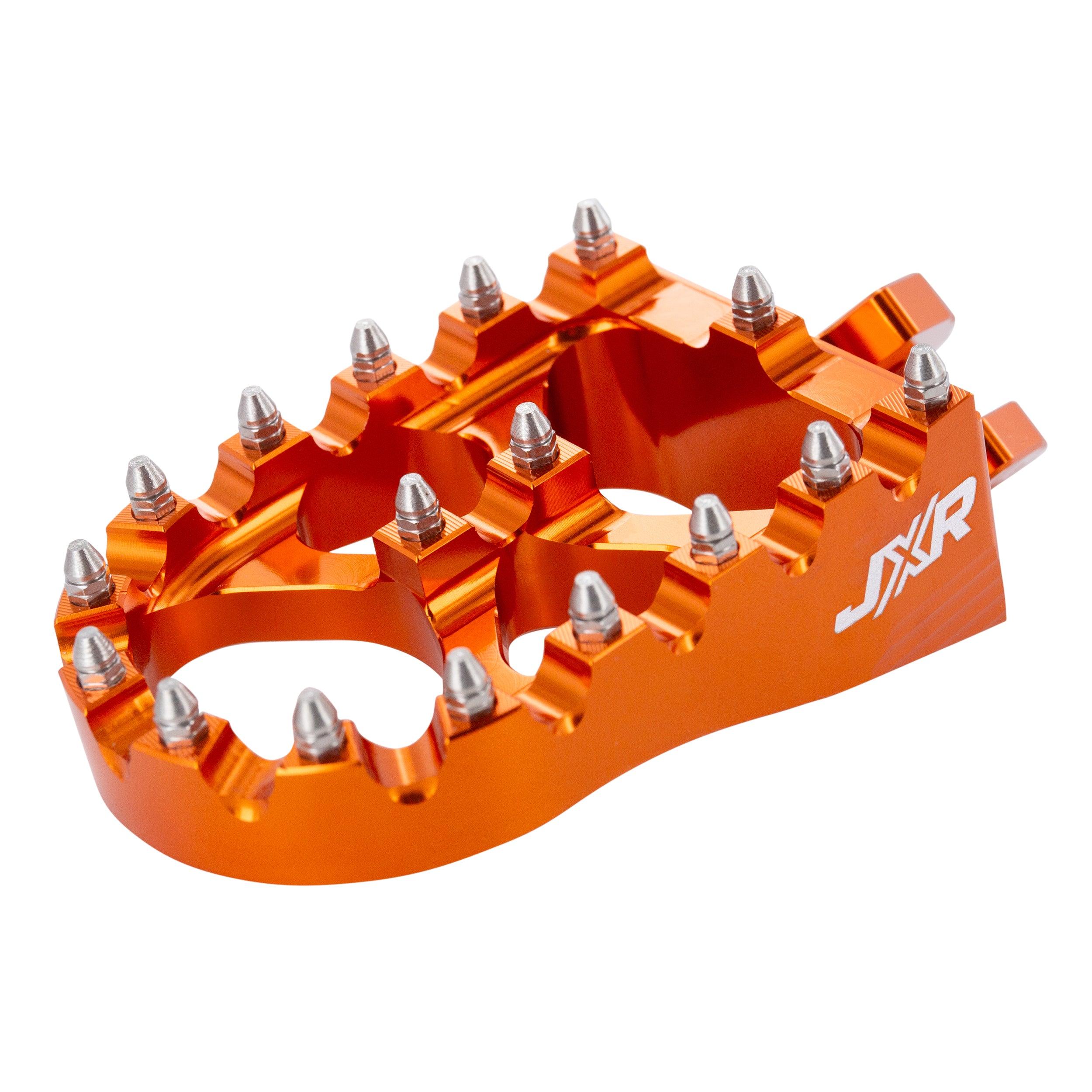 JXR footpegs Talaria Sting close-up showing aggressive teeth design orange