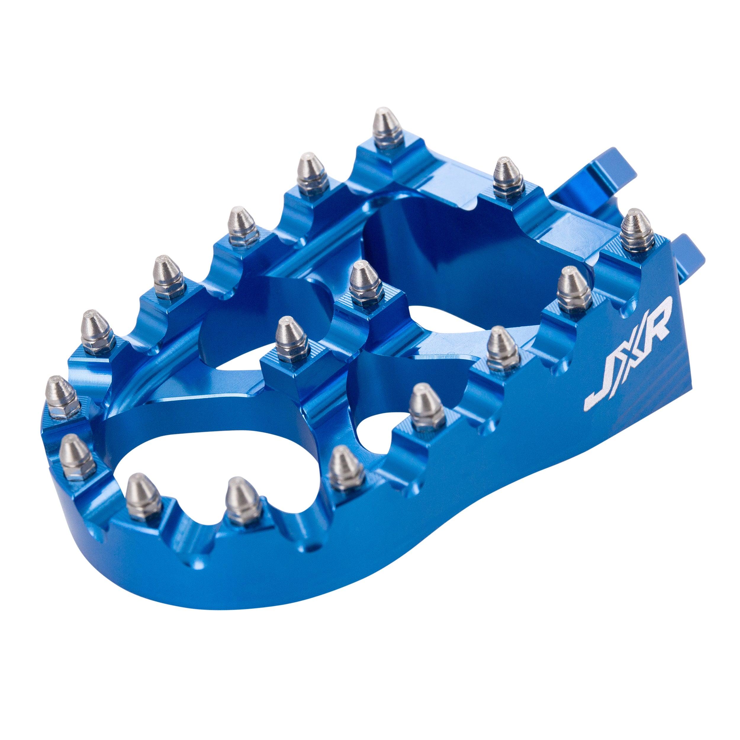 JXR footpegs Talaria Sting close-up showing aggressive teeth design blue