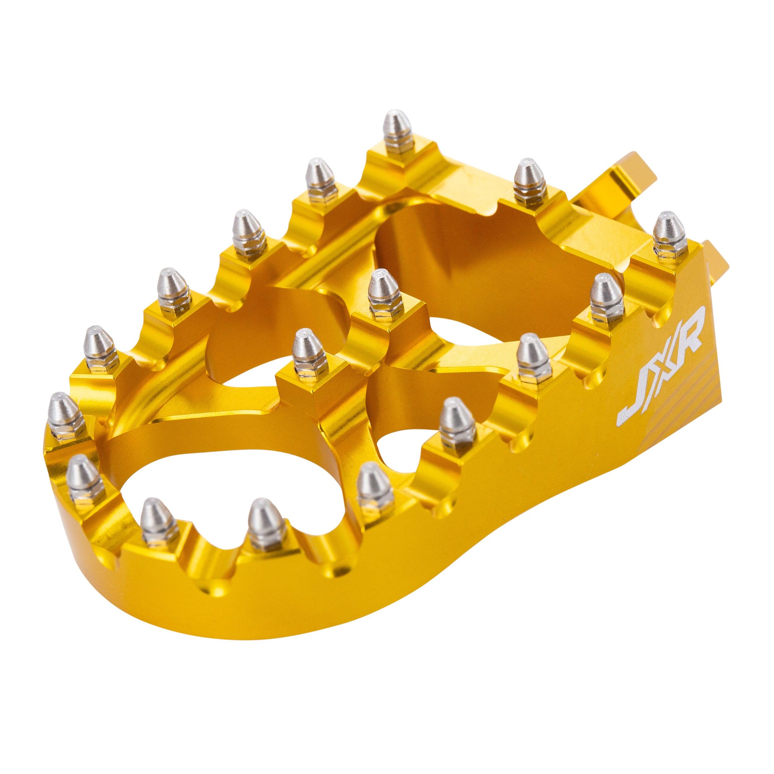 JXR footpegs Talaria Sting close-up showing aggressive teeth design gold