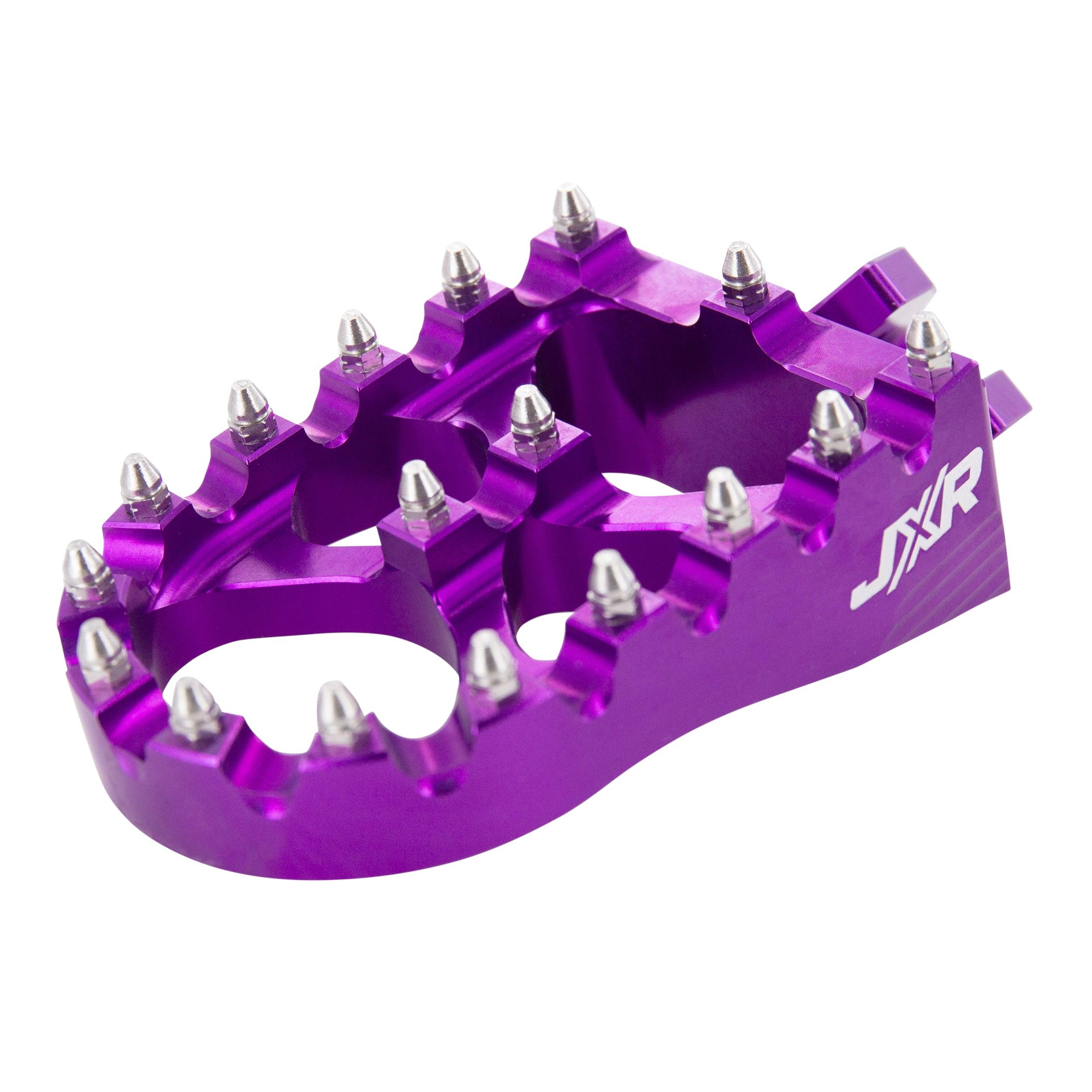JXR footpegs Talaria Sting close-up showing aggressive teeth design purple