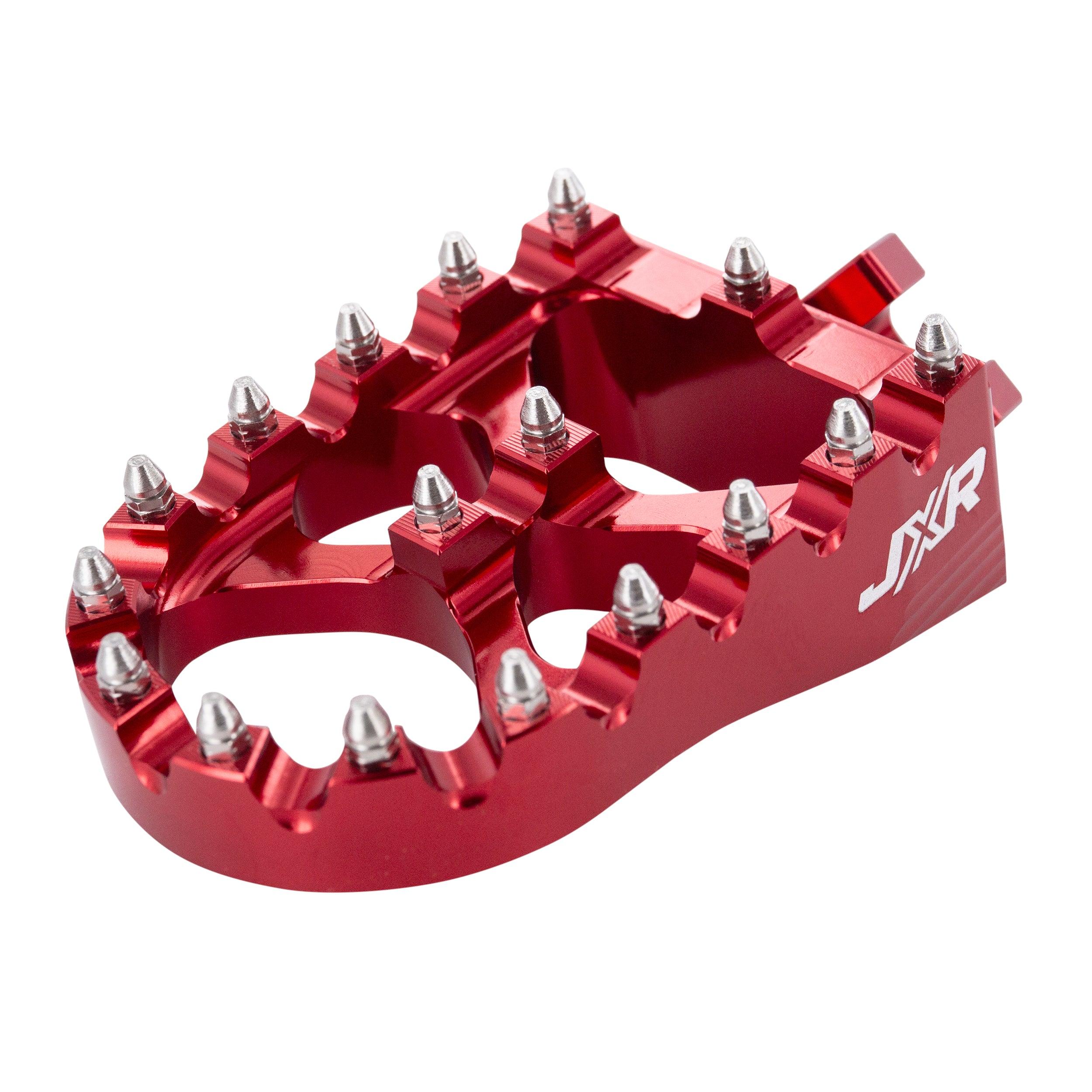 JXR footpegs Talaria Sting close-up showing aggressive teeth design red